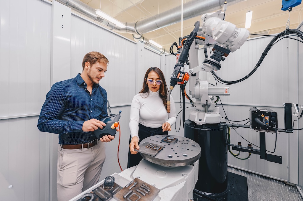 Students demonstrating work at the Cold Spray and Rapid Deposition Laboratory