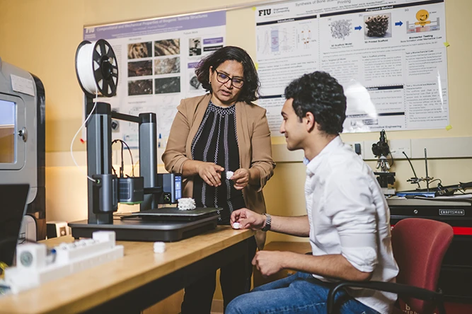 Anamika Prasad in her lab with student