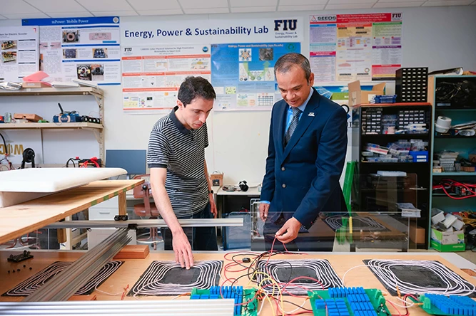 Arif Sarwat and student in the Energy, Power & Sustainability Lab