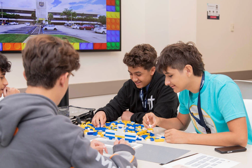 FIU Builders of Tomorrow students in the classroom building with LEGOs