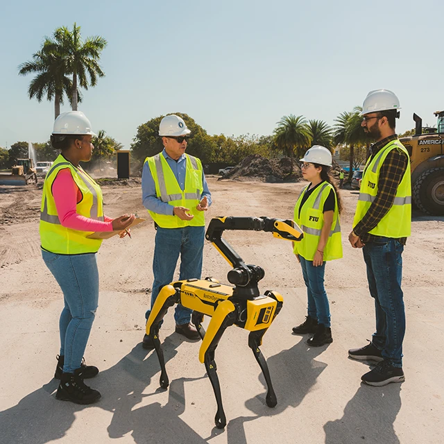 FIU Construction Management students on site with robot dog