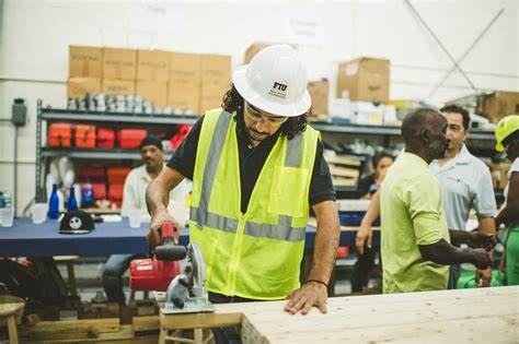 FIU construction student using saw
