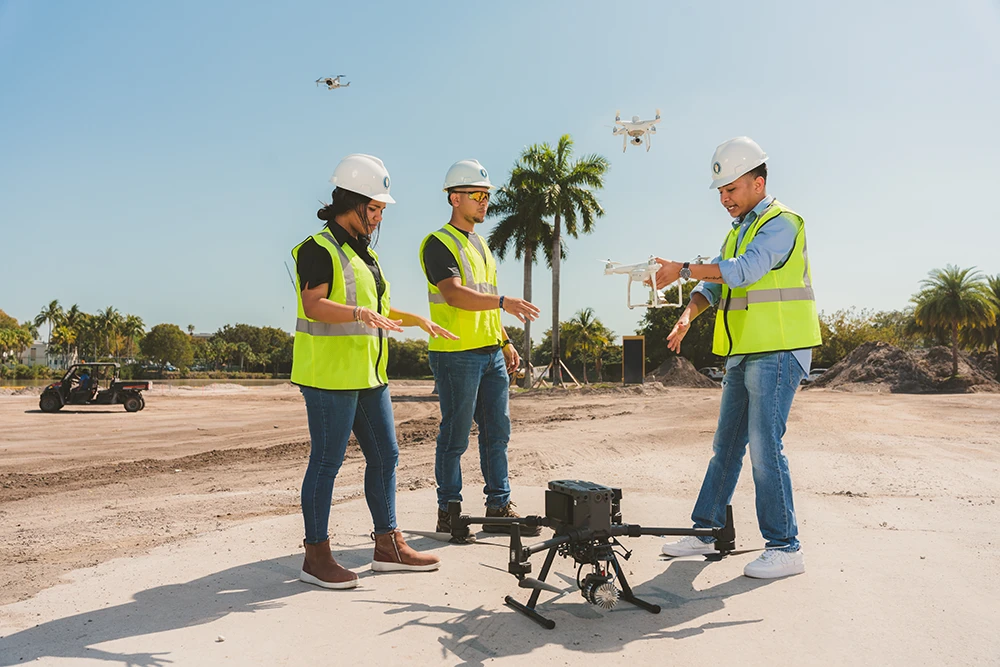 Construction management students learning about drone usage at job sites.