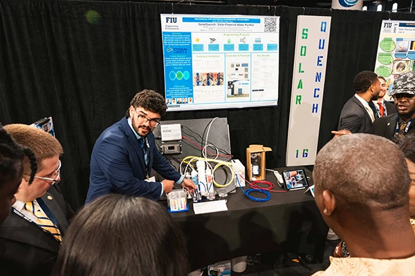 FIU CEC student with environmental project at Senior Design Showcase
